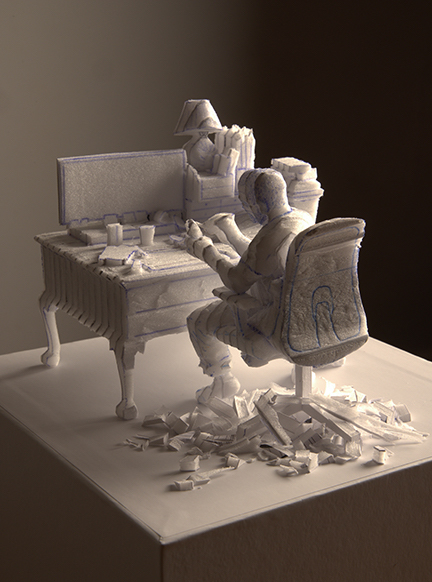 Sculpture by Chris Dorosz of a man sitting at a desk