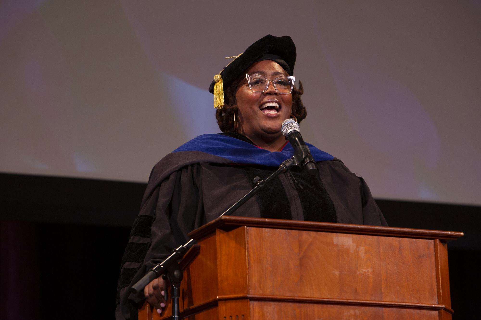 Danielle Drake, CIIS alumna and Dean of Faculty Development DEI speaking at CIIS Commencement