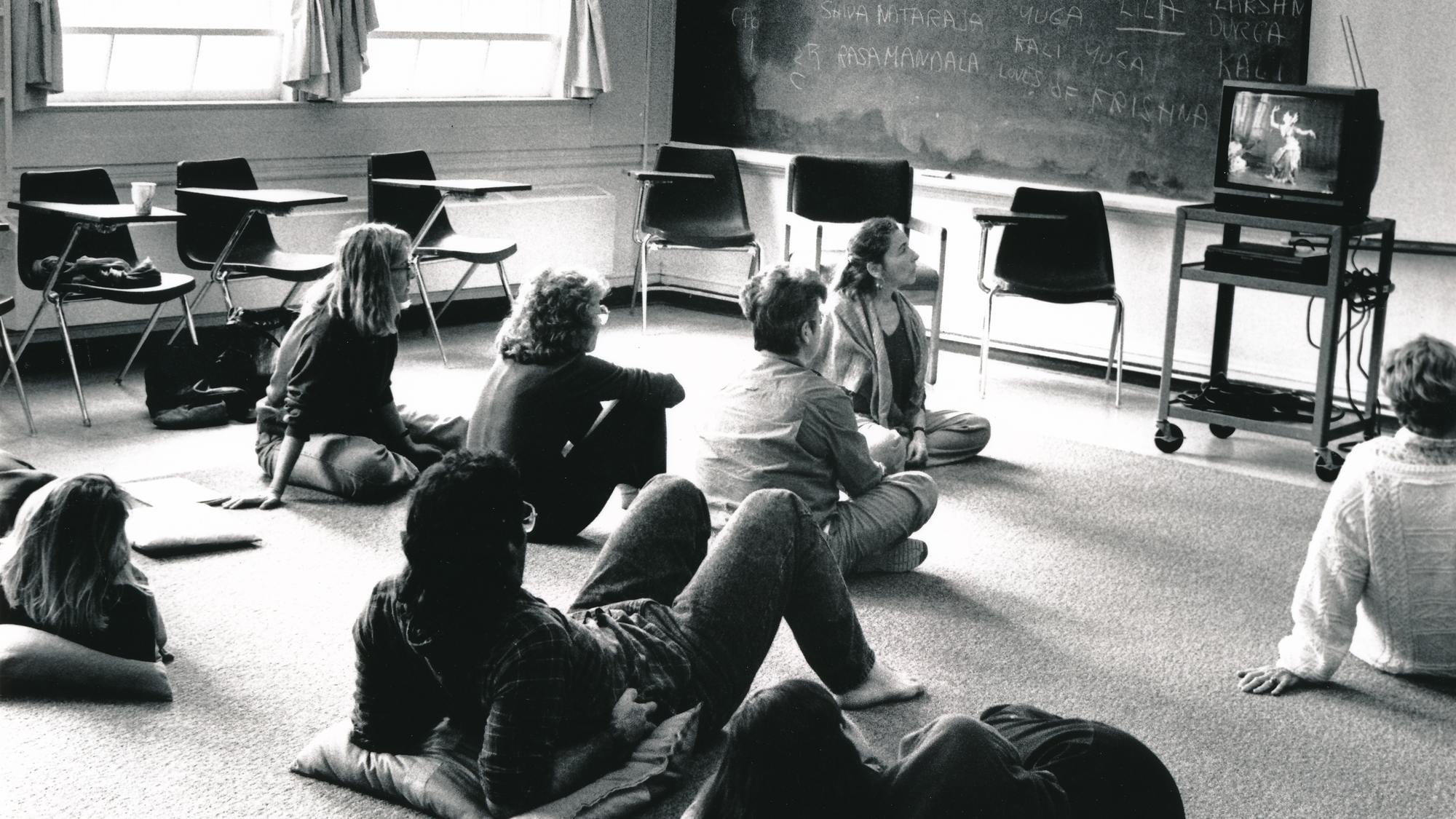 Photo of students in class, sitting on the floor and watching a tv. c.1970-1980. Photo by Christine Anderson.jpg 