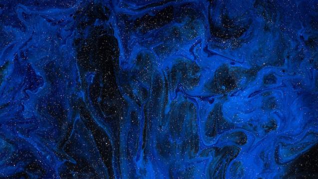 Blue smoke on dark starry background