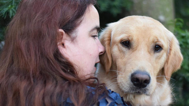 Master of Fine Arts program graduate, Maia Scott and her dog, Gleam.