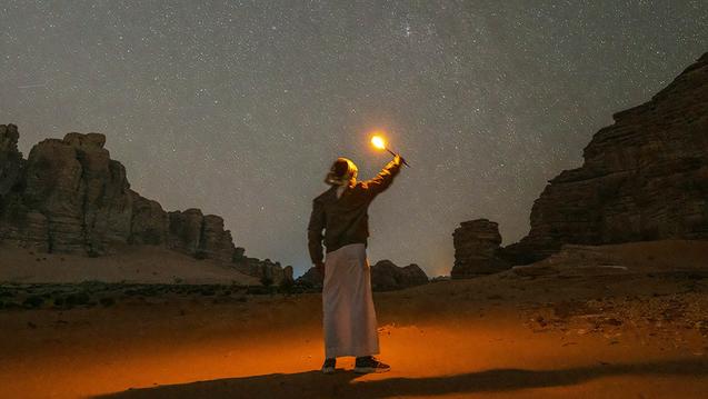 Photo of a light in night sky in desert by NEOM on Unsplash