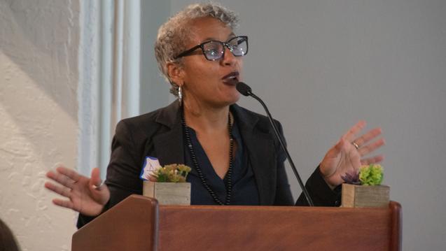 BIPOC Woman at the podium
