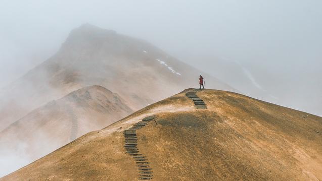 Person walking up a hill