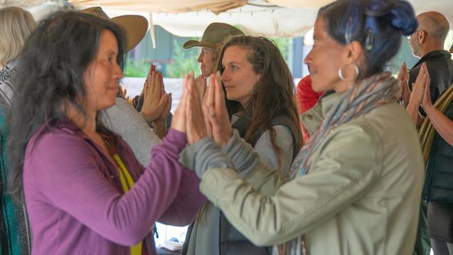 people touching hands in workshop