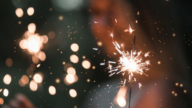 Out of Focus woman holding a sparkler