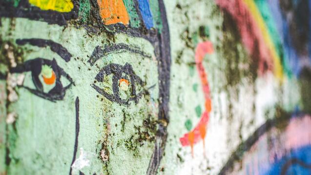 a close up of a painting on a wall