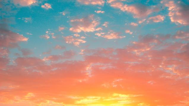 sunset with yellow, orange, and blue sky