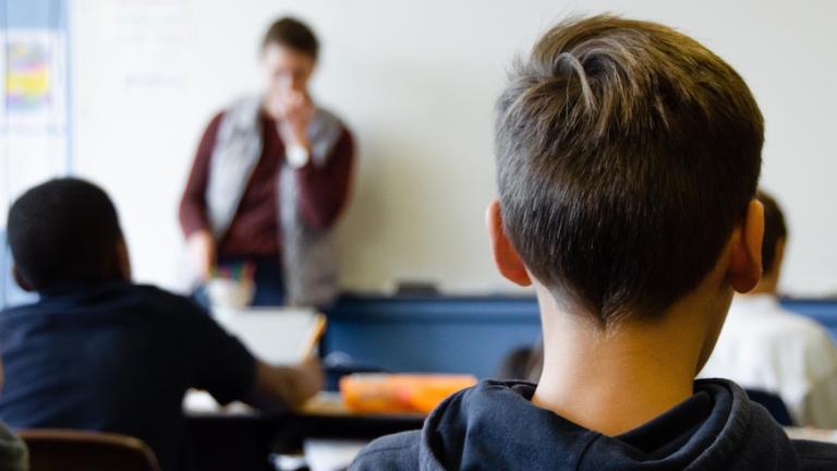 Image of students and teacher in a middle school classroom