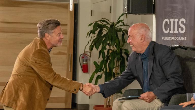 President Brock shaking hands with President Emeritus Robert McDermott