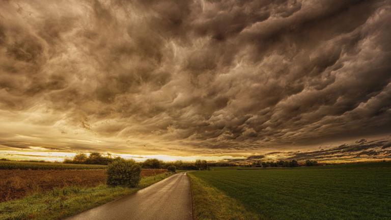 Dark and stormy sky over green flatlands