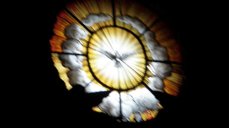 Image of a window decorated with a flying dove. Learn more about the Women's Spirituality online MA and PhD programs at California Institute of Integral Studies, CIIS.