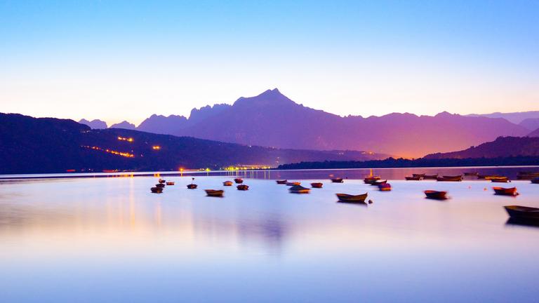 Purple water with boats