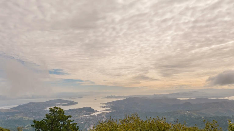 Photo of a cloudy sky over hills