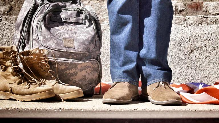 Veteran standing on the sidewalk