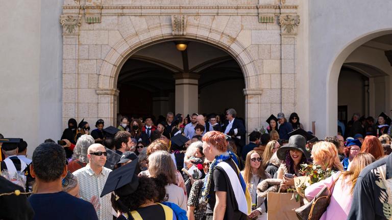 CIIS Graduates outside Sydney Goldstein Auditorium 