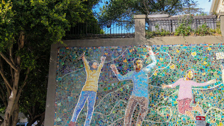 Tile art of people jumping in San Francisco