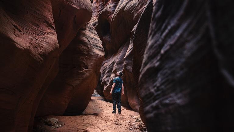 Person standing in a cavern