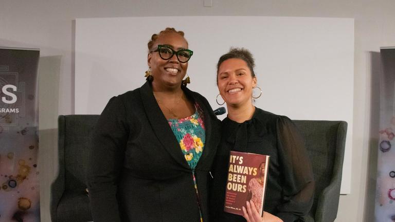 Photo of Danielle Drake with Jessica Wilson holding a copy of the book It's Always Been ours