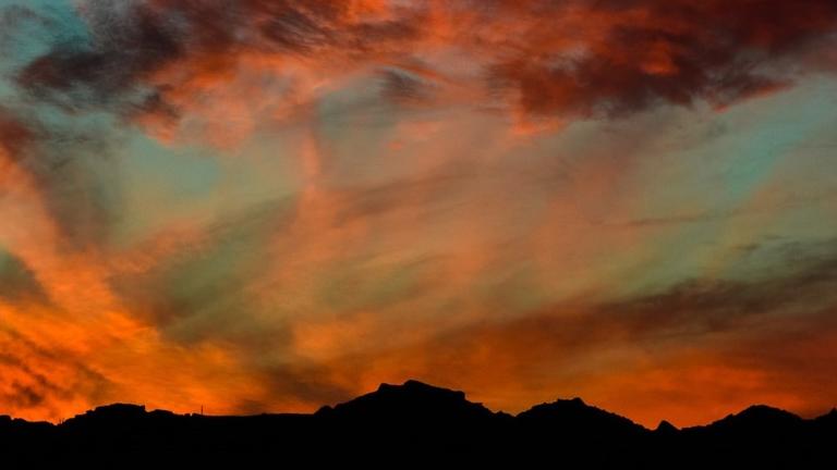 Orange sunset over a mountain range