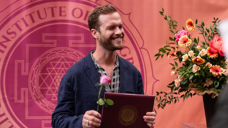 graduate with flower