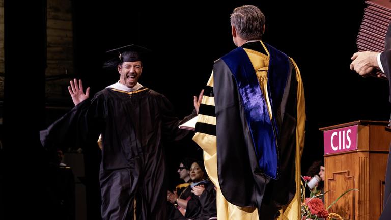 Graduate receiving diploma