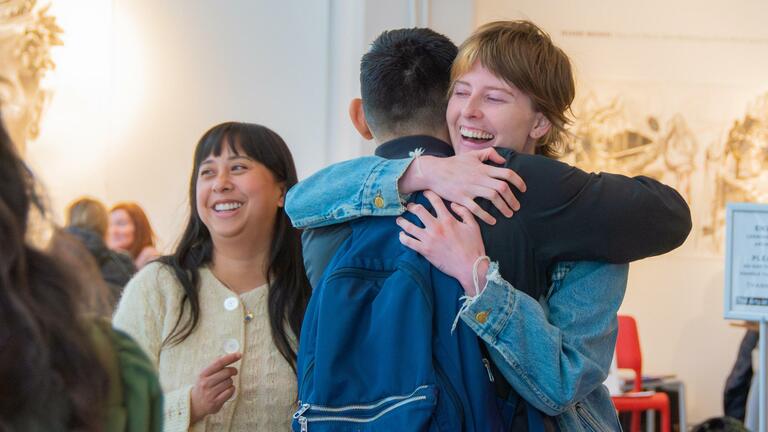 students hugging
