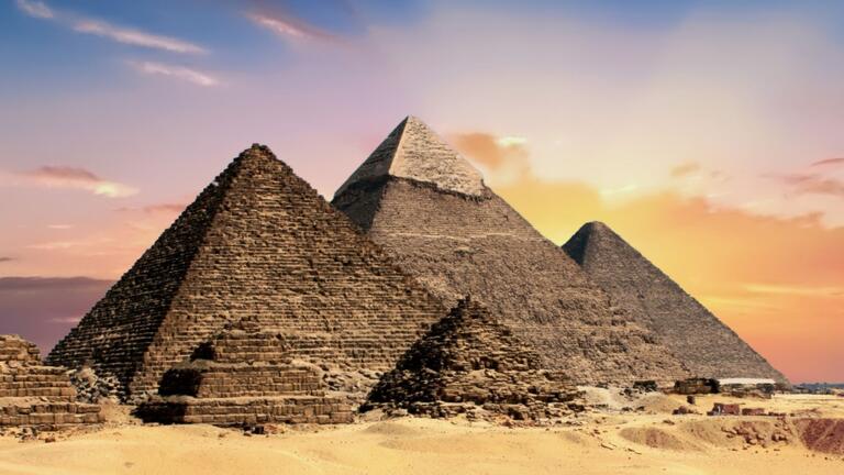 Image of the Giza Pyramid Complex in Cairo, Egypt, during sunset.
