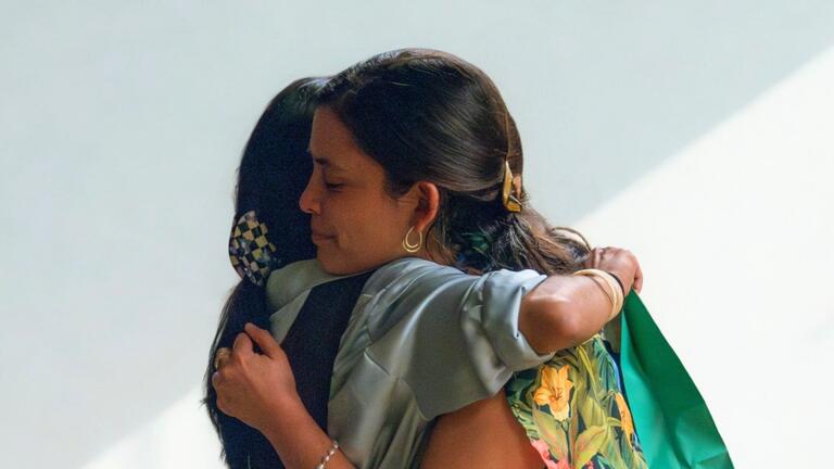 2 students hugging