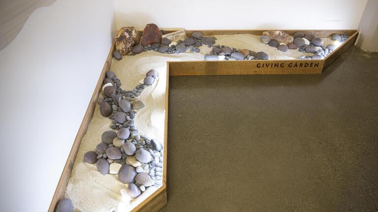 A photo of the Giving Garden Art Installation by Alice Lin in the lobby of CIIS in San Francisco.
