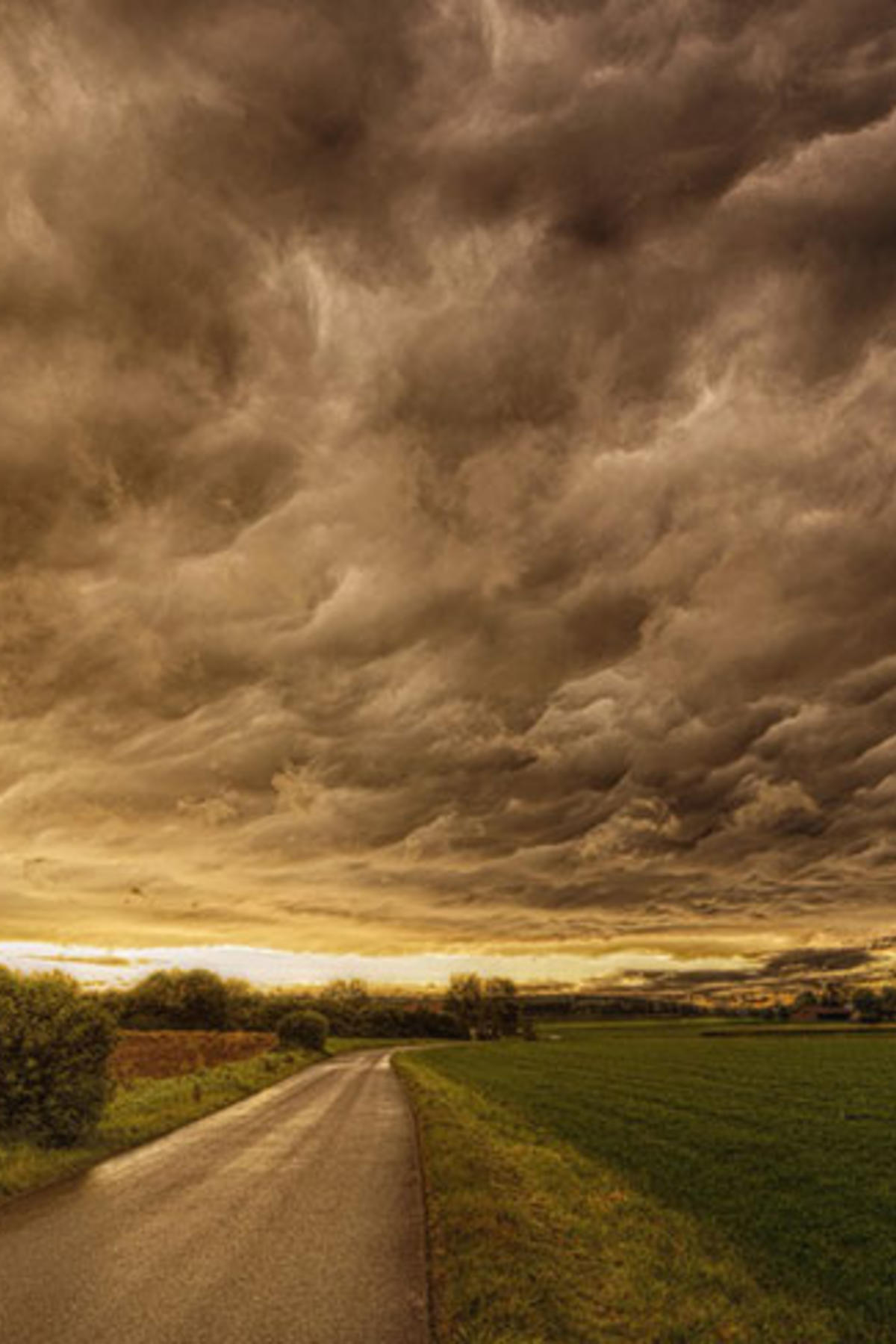 Dark and stormy sky over green flatlands