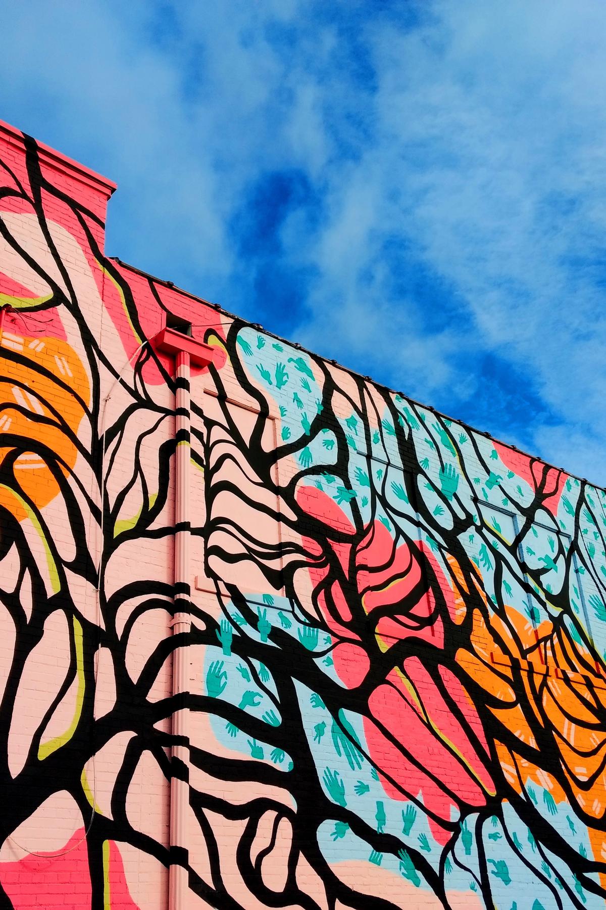 Colorful mural on a wall looking up