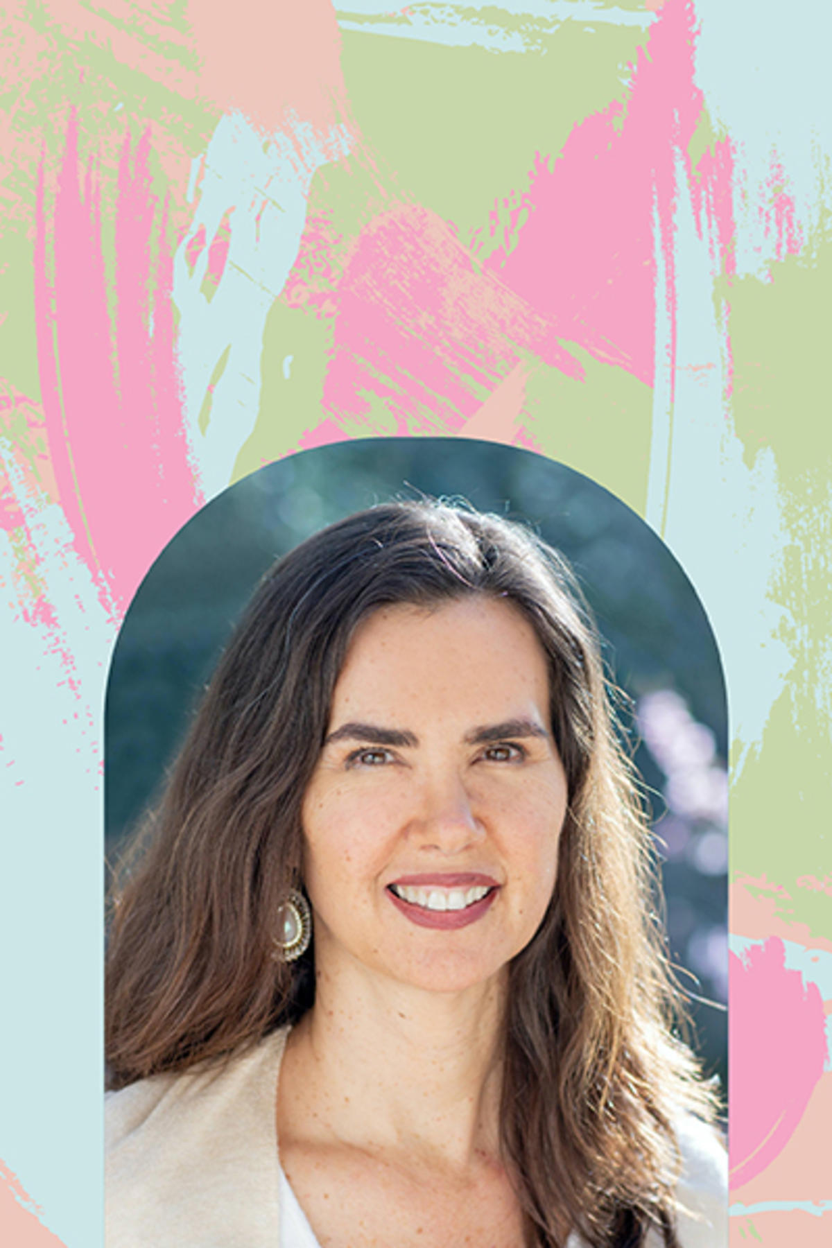 Kristin Neff color portrait. Kristin is a white woman with long, brown hair that goes past her shoulders. She is wearing what appears to be beaded earrings and a light-colored top and is smiling.