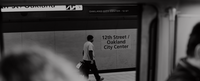Image of the 12th street Oakland Bart station with a person walking