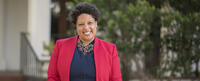 Kathy Littles in a red jacket and black shirt
