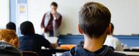 Image of students and teacher in a middle school classroom