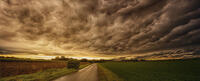 Dark and stormy sky over green flatlands