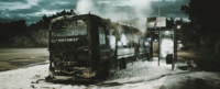 Apocalyptic photo of burnt bus and bus stop