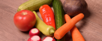 Vegetables on a wooden table.  Find out more about the Integrative Health online M.A. program at California Institute of Integral Studies (CIIS)
