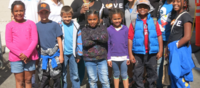 Kids posing for a picture at Glide