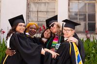 Graduates hugging each othere