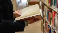 Person hold book at CIIS library